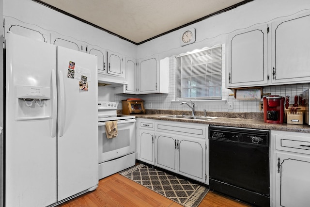 kitchen with sink, white appliances, light hardwood / wood-style flooring, ornamental molding, and white cabinets