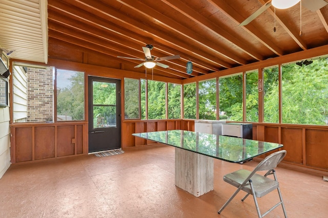 unfurnished sunroom featuring ceiling fan