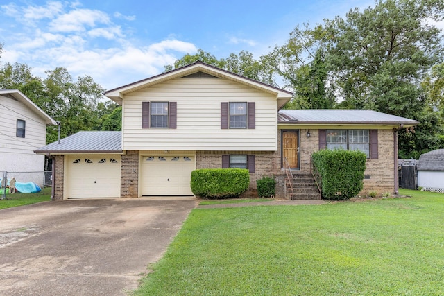 tri-level home with a front yard