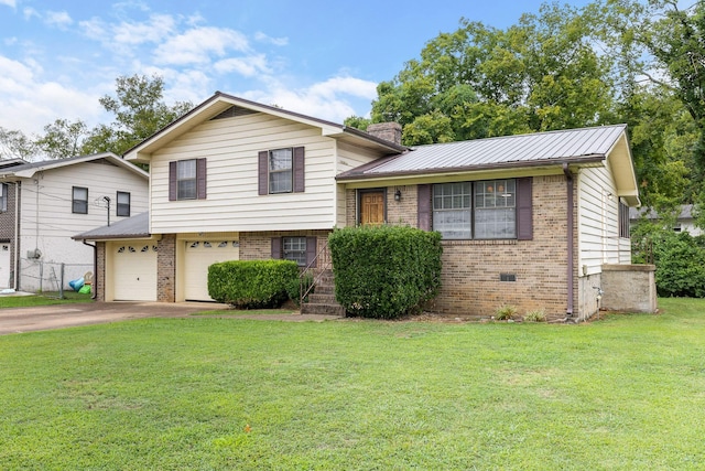 split level home featuring a garage and a front lawn