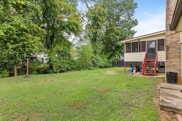 view of yard featuring a sunroom