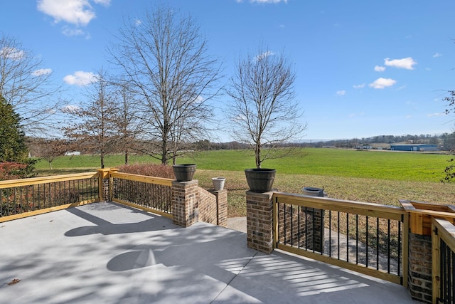 view of patio / terrace with a rural view