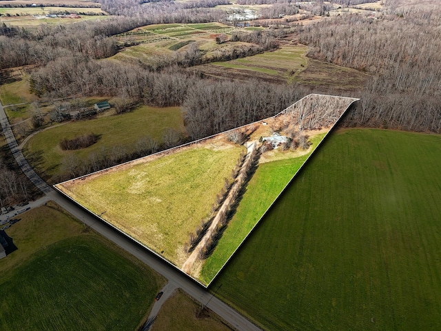 birds eye view of property featuring a rural view