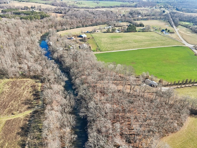 birds eye view of property featuring a rural view and a water view