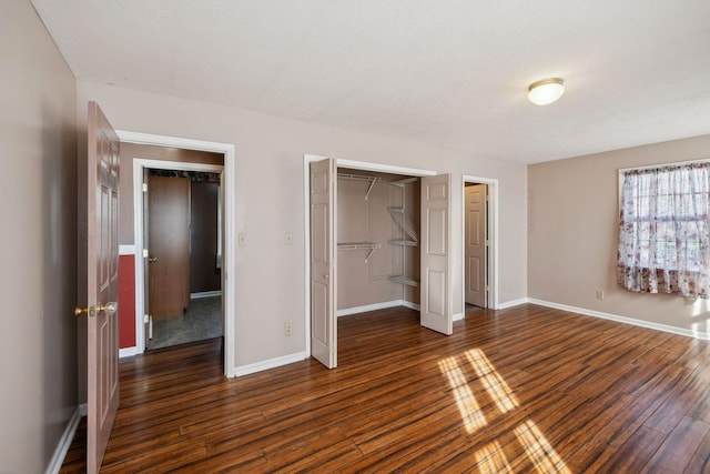 unfurnished bedroom featuring dark hardwood / wood-style floors