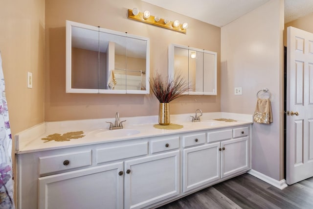 bathroom featuring vanity and hardwood / wood-style flooring