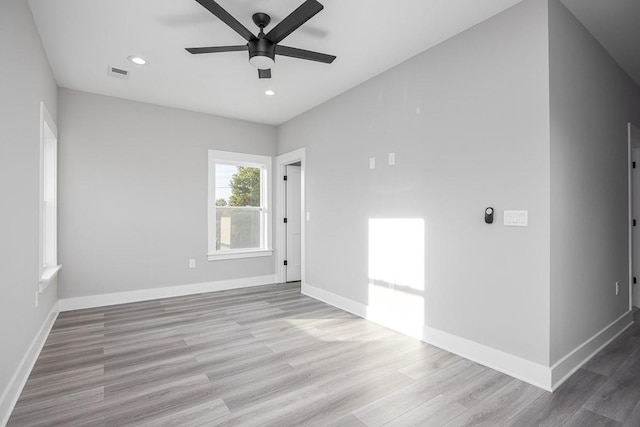 spare room featuring ceiling fan and light hardwood / wood-style floors