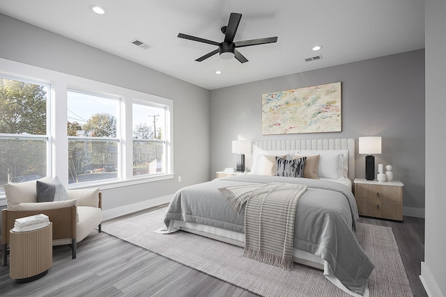 bedroom featuring hardwood / wood-style floors and ceiling fan