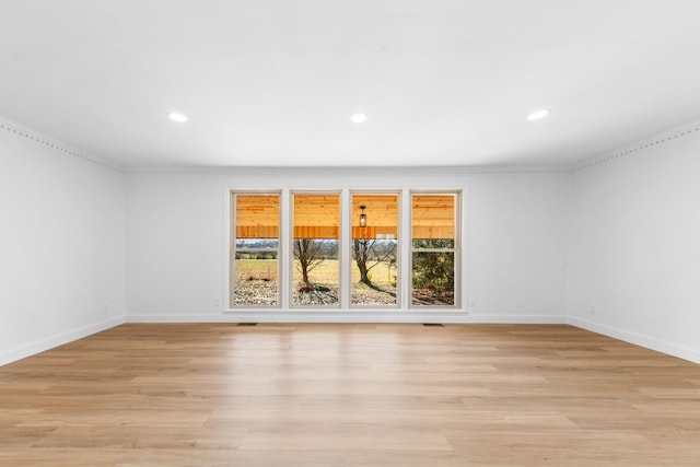 empty room with light hardwood / wood-style flooring