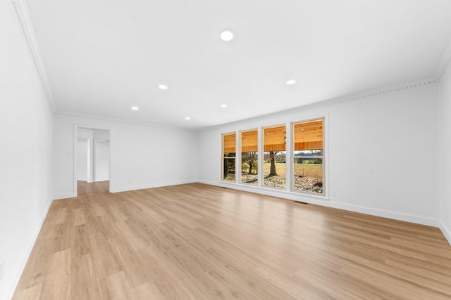 unfurnished living room with light wood-type flooring and crown molding