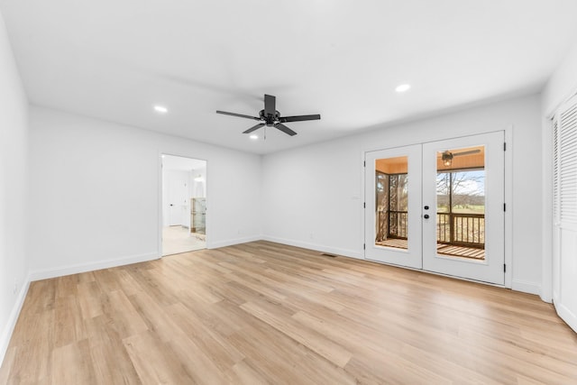 unfurnished room with ceiling fan, french doors, and light hardwood / wood-style floors