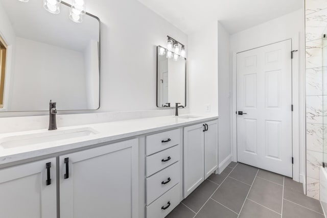 bathroom with tile patterned flooring and vanity