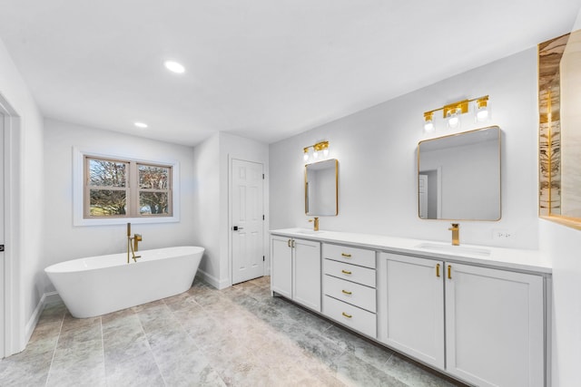 bathroom with a bathtub and vanity