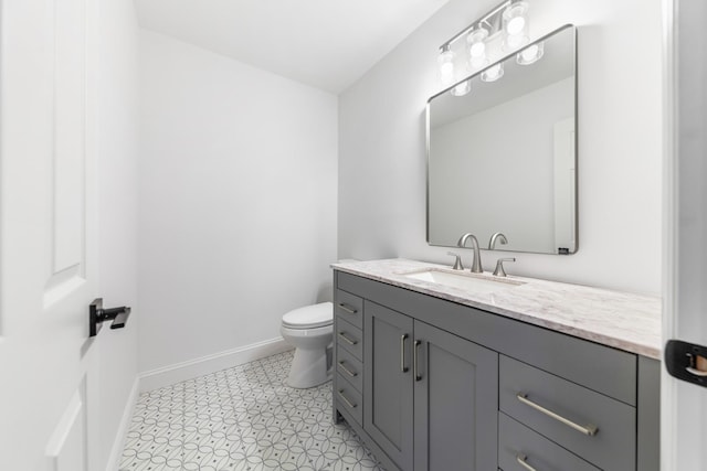 bathroom featuring toilet and vanity