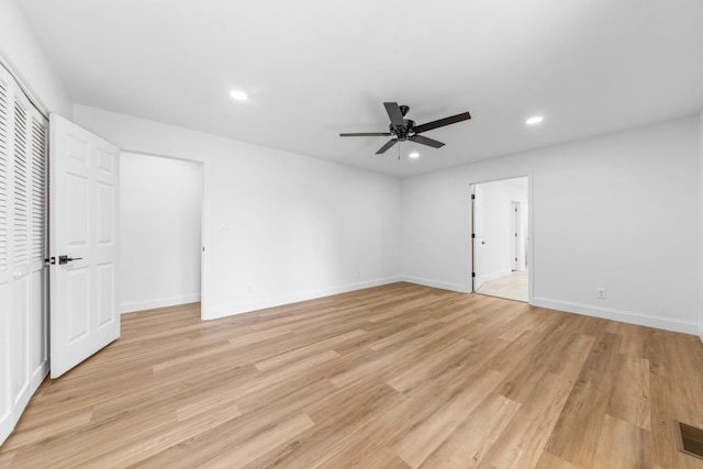 spare room featuring ceiling fan and light wood-type flooring