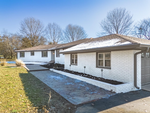 ranch-style home with a garage