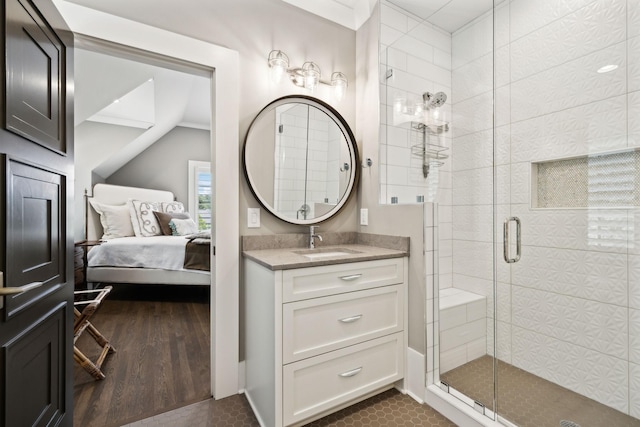 bathroom with walk in shower and vanity