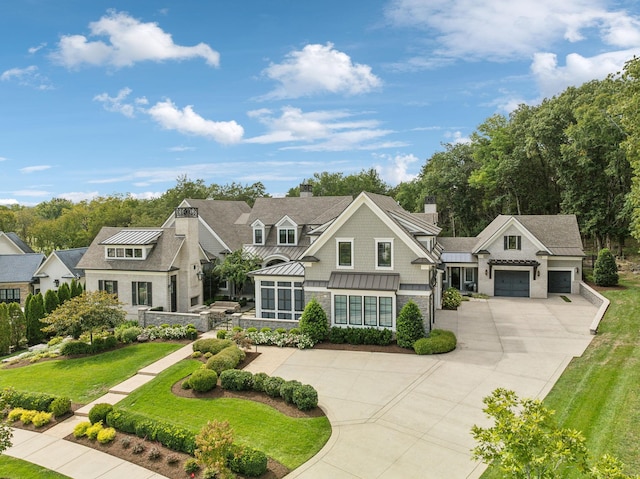 view of front facade with a front lawn and a garage