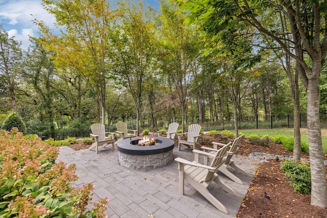 view of patio / terrace featuring an outdoor fire pit