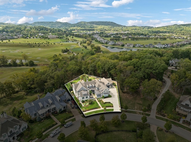 birds eye view of property with a mountain view