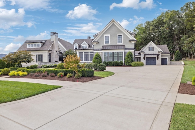 view of front facade featuring a front lawn and a garage