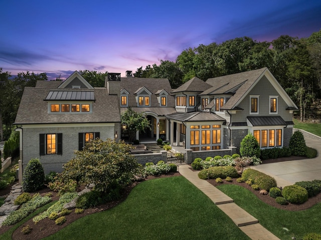 view of front of home featuring a lawn