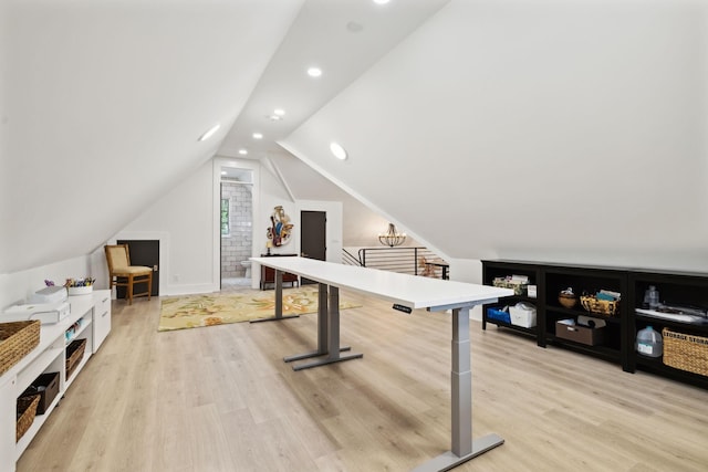 rec room with lofted ceiling and light hardwood / wood-style flooring