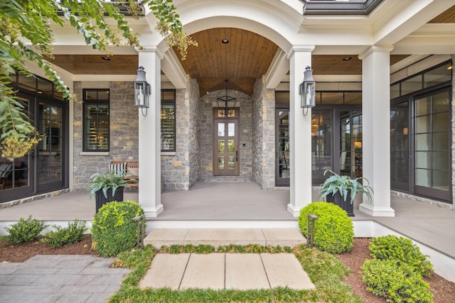 doorway to property featuring covered porch