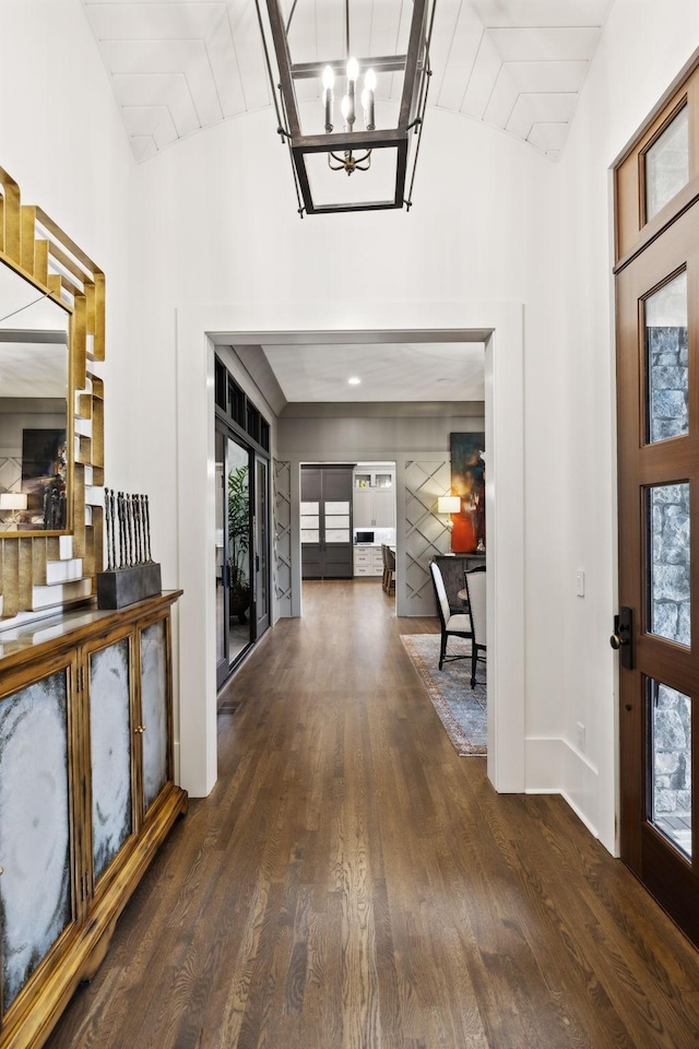 entryway with wood ceiling, french doors, an inviting chandelier, and vaulted ceiling