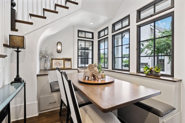 dining area with breakfast area and dark wood-type flooring