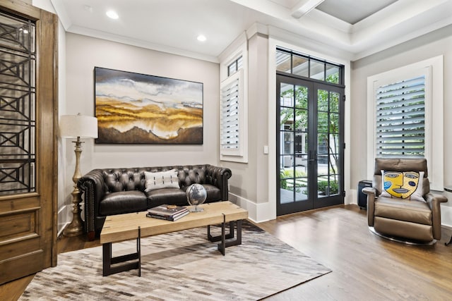 interior space with ornamental molding, french doors, and hardwood / wood-style flooring