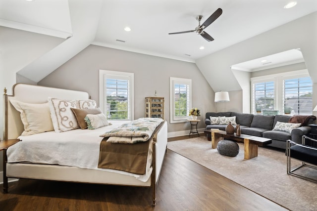 bedroom with ceiling fan, dark wood-type flooring, ornamental molding, and vaulted ceiling