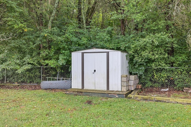 view of outbuilding featuring a yard