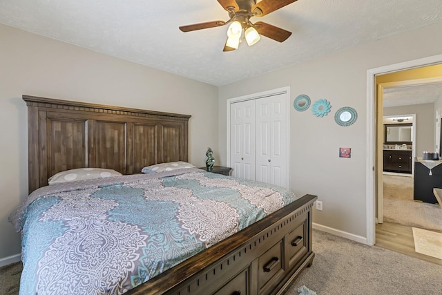 carpeted bedroom featuring ceiling fan and a closet