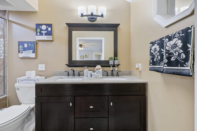 bathroom with ceiling fan, vanity, and toilet