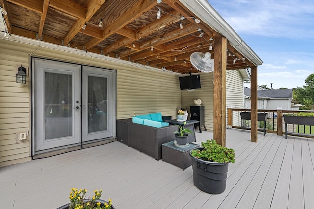 deck featuring french doors and an outdoor hangout area