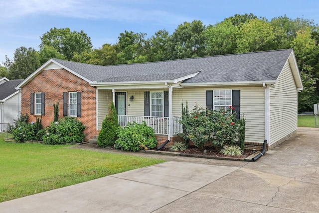 single story home with a porch and a front lawn