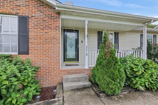 property entrance featuring covered porch