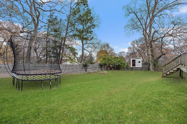 view of yard featuring a trampoline