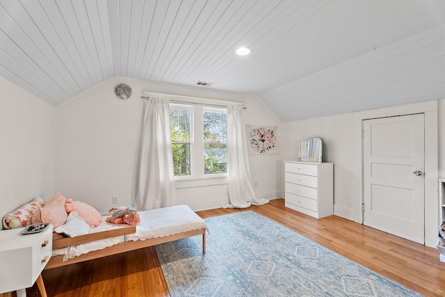 bedroom featuring light wood-type flooring, wooden ceiling, and vaulted ceiling