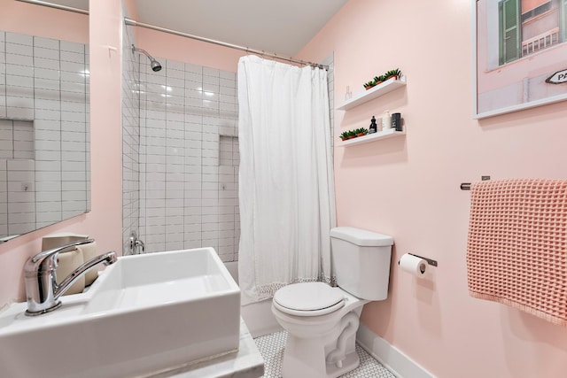 bathroom featuring sink, a shower with curtain, tile patterned flooring, and toilet