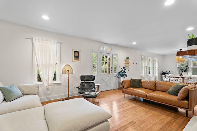 living room with light hardwood / wood-style flooring