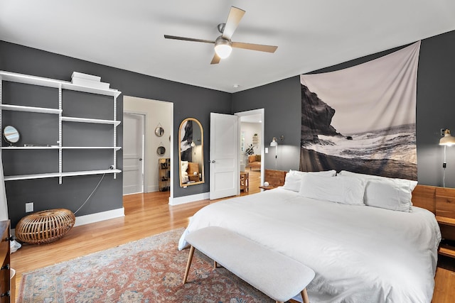 bedroom with ceiling fan and hardwood / wood-style flooring