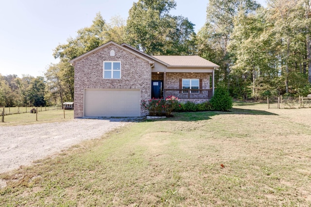 view of front of home featuring a porch, a front lawn, and a garage