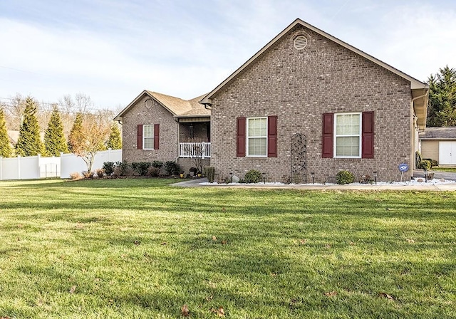 front facade with a front yard