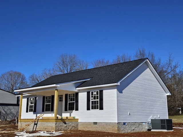 view of front facade with central air condition unit and covered porch