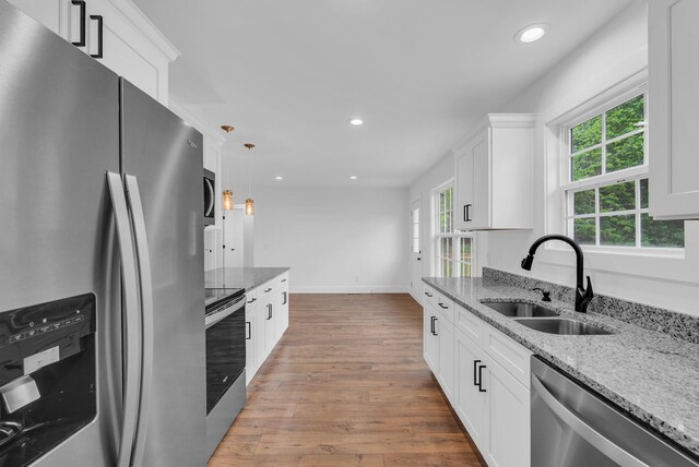 286 Wilhite, Doyle, TN 38559 - kitchen with appliances with stainless steel finishes, a sink, plenty of natural light, recessed lighting, and wood finished floors