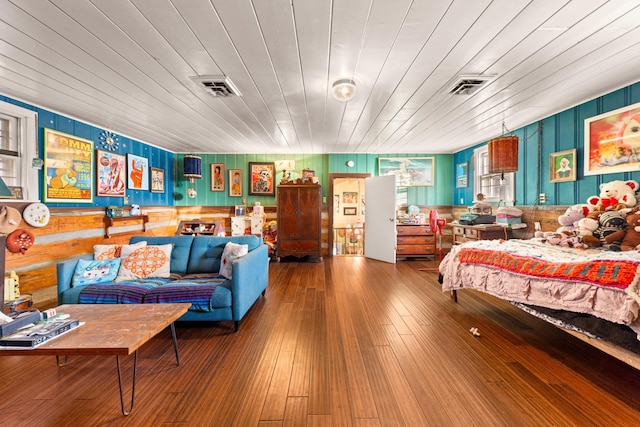 bedroom featuring hardwood / wood-style flooring and wood ceiling