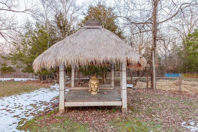 snowy yard featuring a gazebo