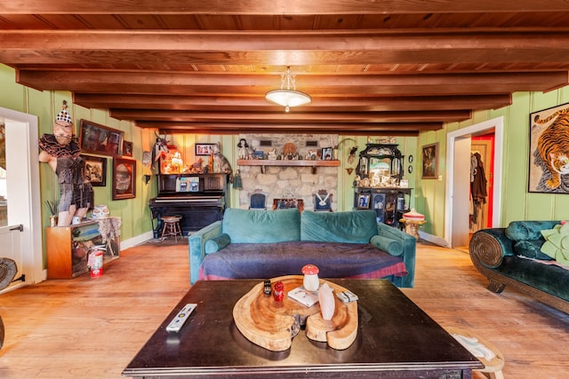 living room with light wood-type flooring, wooden ceiling, and beamed ceiling